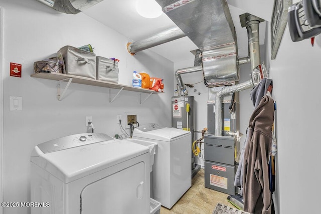 clothes washing area with separate washer and dryer, electric water heater, and light tile patterned floors