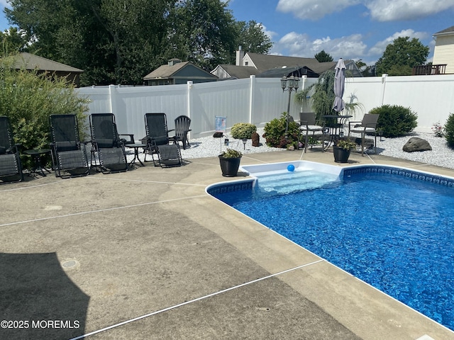 view of swimming pool featuring a patio area