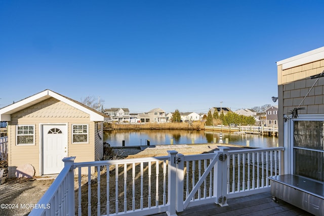 wooden deck featuring a water view