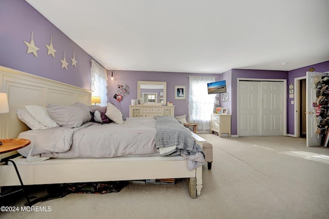 carpeted bedroom featuring a closet