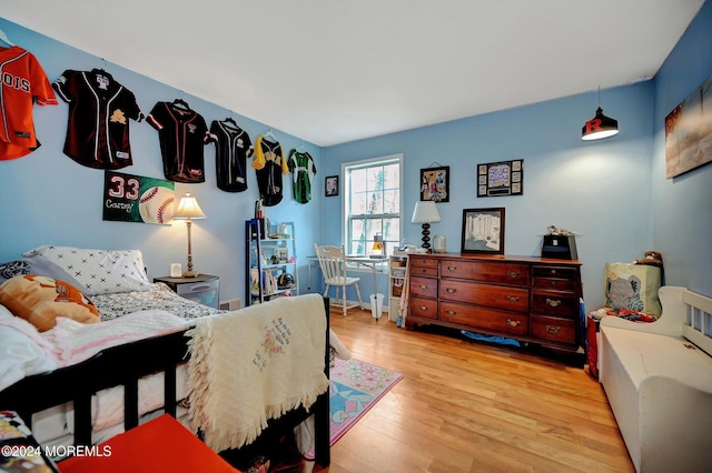 bedroom with light hardwood / wood-style flooring