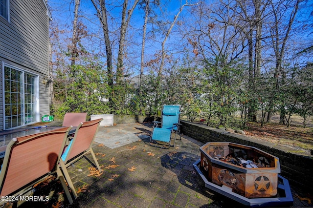 view of patio / terrace with a fire pit