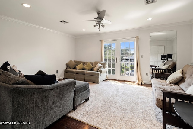 living room with hardwood / wood-style floors, french doors, ornamental molding, and ceiling fan