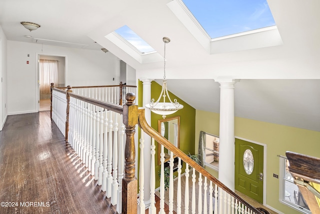 hall featuring dark hardwood / wood-style floors and vaulted ceiling