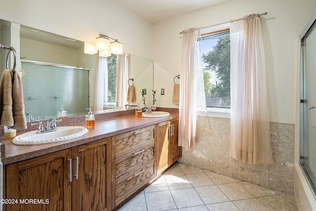 bathroom with vanity, tile patterned floors, and a wealth of natural light