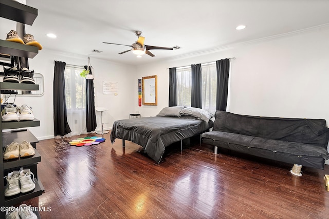 bedroom with wood-type flooring, ceiling fan, and crown molding