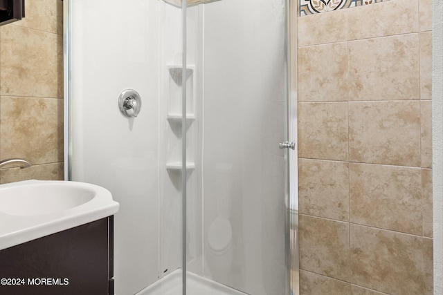 bathroom featuring an enclosed shower