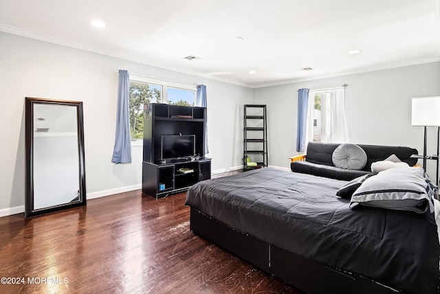 bedroom featuring dark hardwood / wood-style floors and crown molding