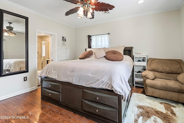 bedroom featuring connected bathroom, crown molding, ceiling fan, and dark wood-type flooring