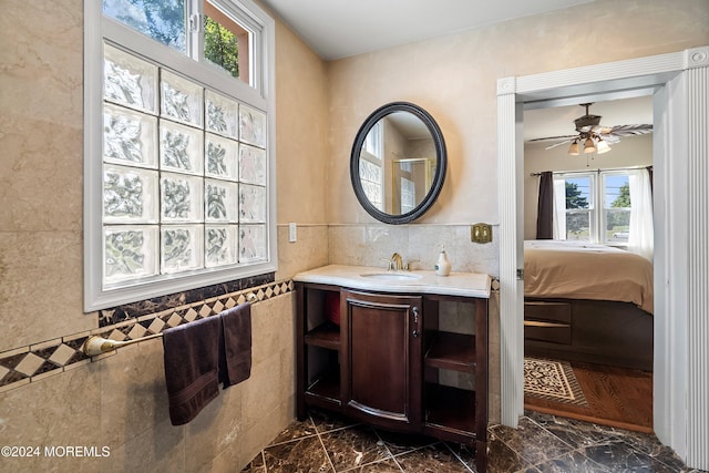 bathroom featuring ceiling fan and vanity