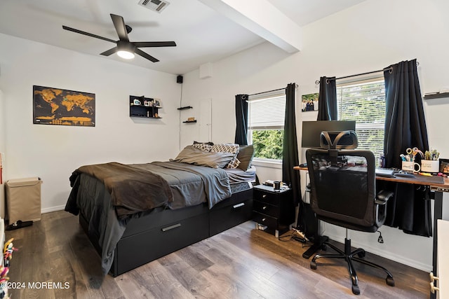 bedroom featuring beam ceiling, ceiling fan, and hardwood / wood-style flooring