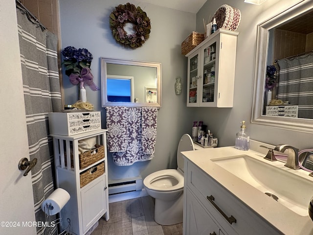 bathroom featuring vanity, a baseboard heating unit, hardwood / wood-style floors, and toilet