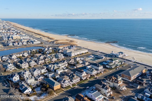 aerial view featuring a view of the beach and a water view