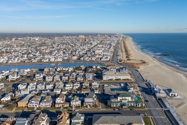 bird's eye view with a water view and a view of the beach