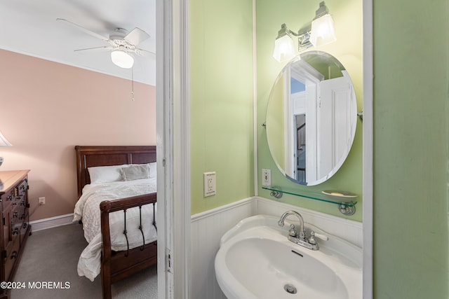 bathroom featuring ceiling fan and sink