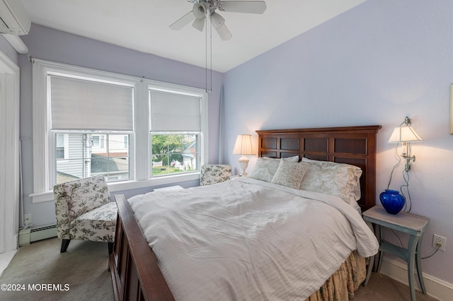 carpeted bedroom featuring ceiling fan, a wall mounted air conditioner, and a baseboard heating unit