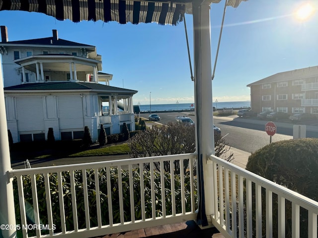 balcony featuring a water view