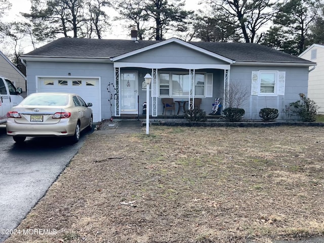 6 Westport Dr, Toms River, NJ 08757 - view of front facade with a porch and a garage