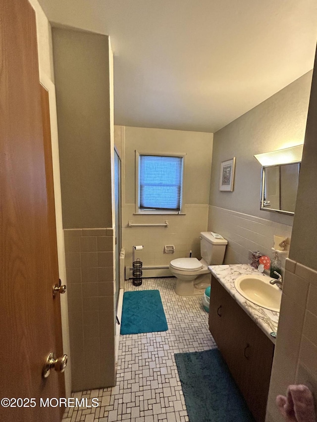 6 Westport Dr, Toms River, NJ 08757 - bathroom with vanity, toilet, tile walls, and a shower with shower door