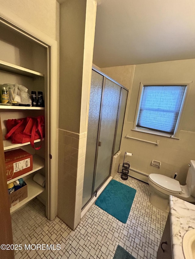 6 Westport Dr, Toms River, NJ 08757 - bathroom with vanity, toilet, a shower with shower door, and tile walls
