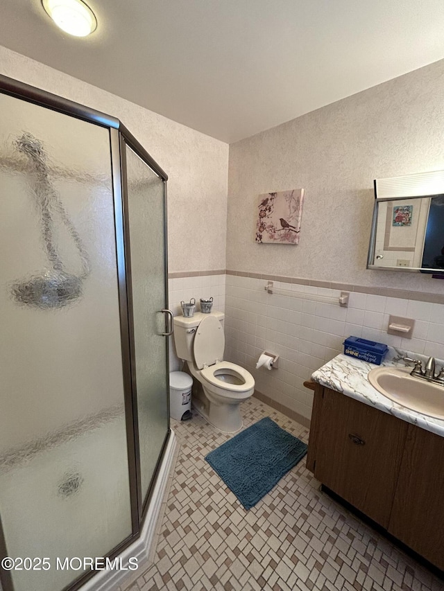 6 Westport Dr, Toms River, NJ 08757 - bathroom with toilet, vanity, tile walls, and walk in shower