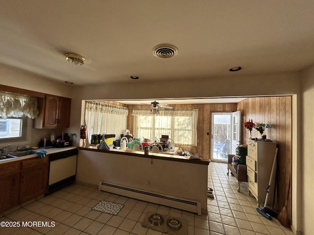6 Westport Dr, Toms River, NJ 08757 - kitchen featuring dishwasher, sink, baseboard heating, kitchen peninsula, and light tile patterned flooring