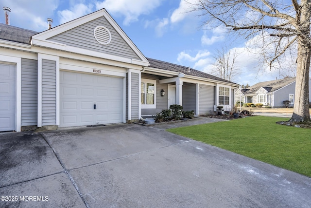 ranch-style home with a garage and a front lawn