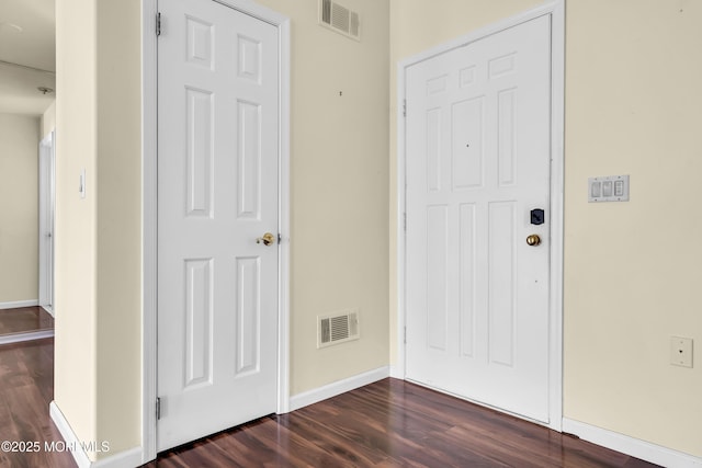 entrance foyer featuring dark hardwood / wood-style floors