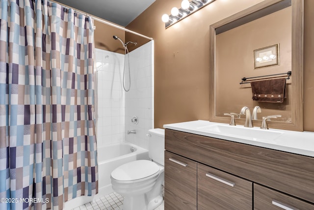 full bathroom with tile patterned floors, toilet, vanity, and shower / bath combo