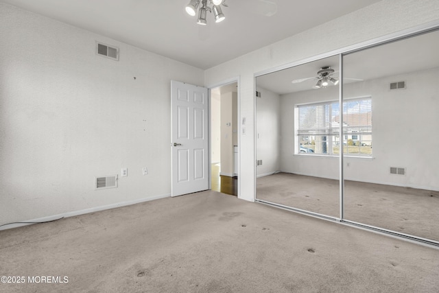 unfurnished bedroom featuring a closet and carpet flooring