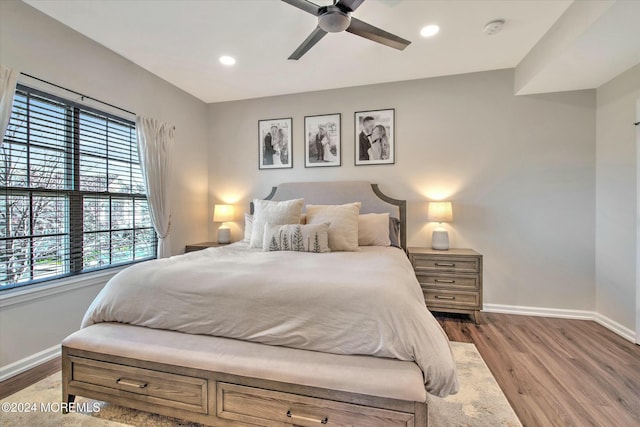 bedroom featuring ceiling fan and light hardwood / wood-style floors