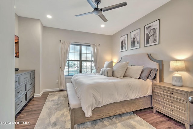 bedroom with dark wood-type flooring and ceiling fan