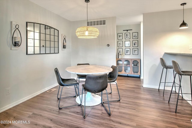 dining area with hardwood / wood-style floors