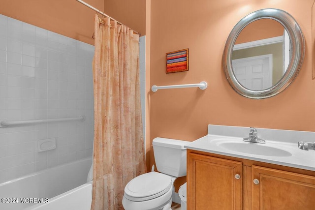 full bathroom featuring shower / tub combo, vanity, and toilet