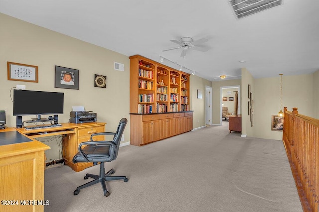 office area featuring light colored carpet, track lighting, and ceiling fan