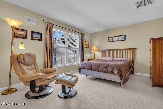 bedroom featuring light colored carpet