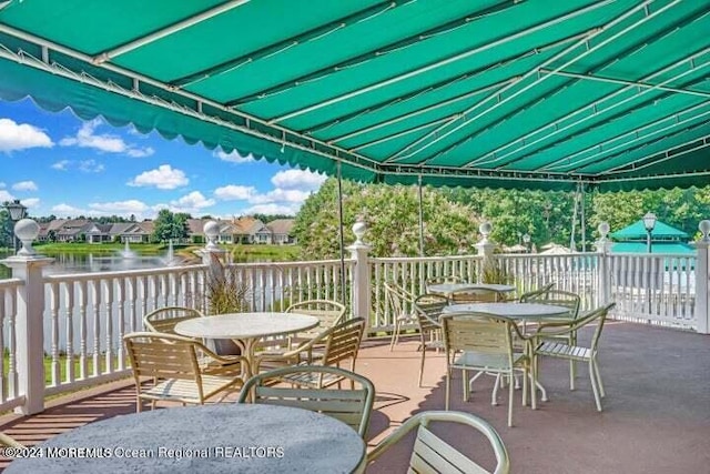 view of patio with a water view