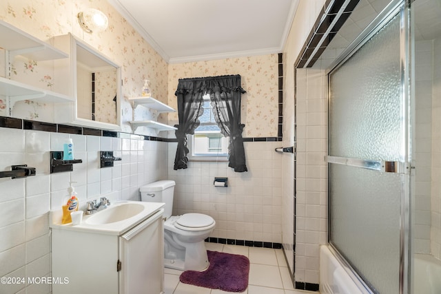 full bathroom featuring ornamental molding, shower / bath combination with glass door, tile walls, tile patterned flooring, and toilet