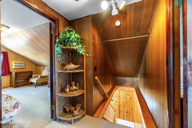 interior space featuring wood ceiling, an AC wall unit, and wooden walls