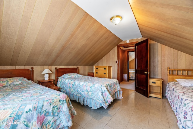 bedroom featuring wood walls, wooden ceiling, and vaulted ceiling