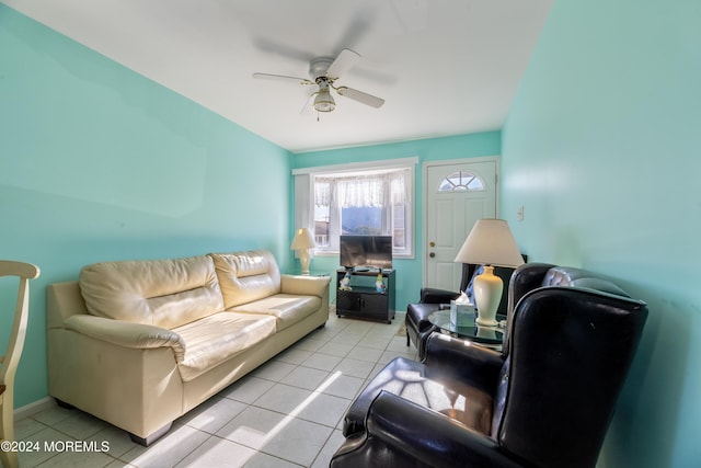 tiled living room with ceiling fan