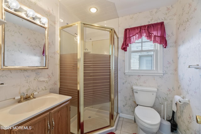 bathroom featuring toilet, tile patterned flooring, vanity, and walk in shower