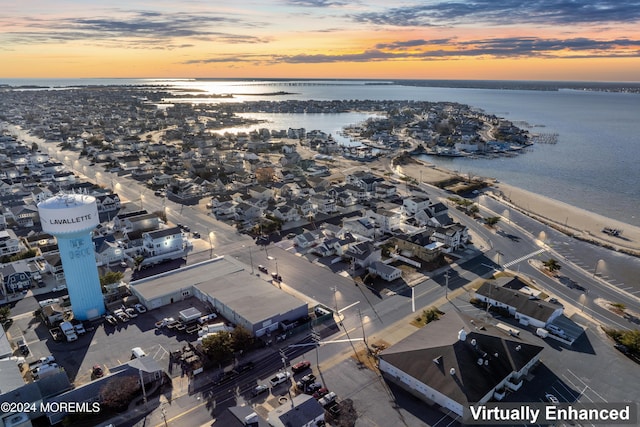 aerial view at dusk with a water view