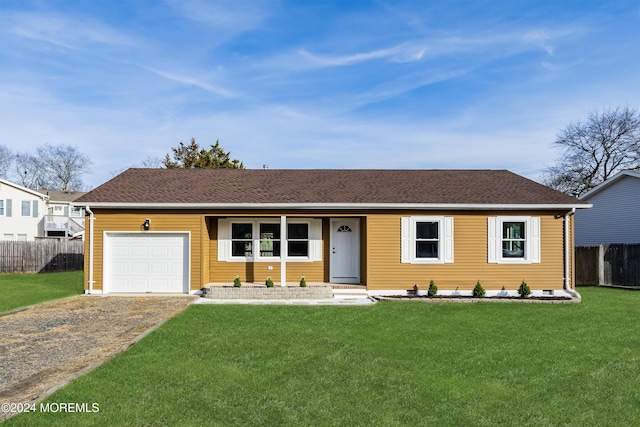 ranch-style home featuring a front yard and a garage