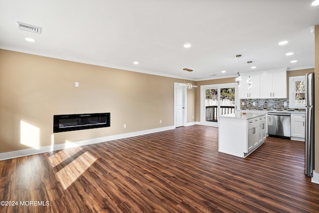 kitchen with white cabinets, pendant lighting, dark hardwood / wood-style flooring, and stainless steel appliances