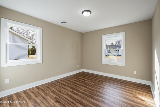 empty room featuring hardwood / wood-style flooring