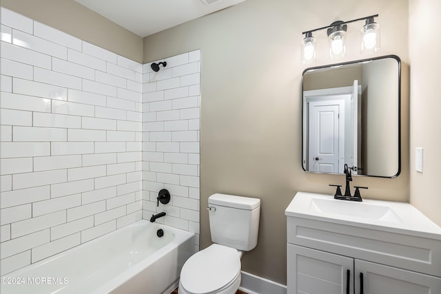 full bathroom featuring vanity, toilet, and tiled shower / bath