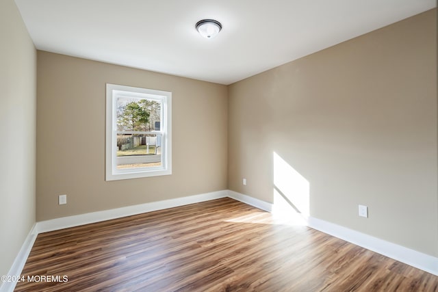 empty room featuring hardwood / wood-style flooring