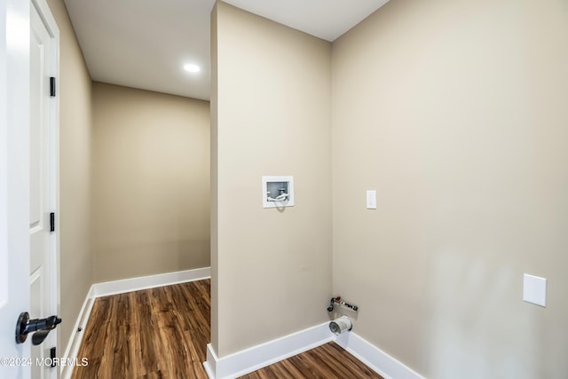 laundry area with hookup for a gas dryer, hookup for a washing machine, and dark hardwood / wood-style floors