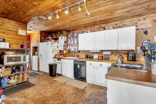 790 Farmingdale Rd, Jackson, NJ 08527 - kitchen featuring track lighting, dishwasher, stainless steel microwave, white refrigerator with ice dispenser, and wood walls